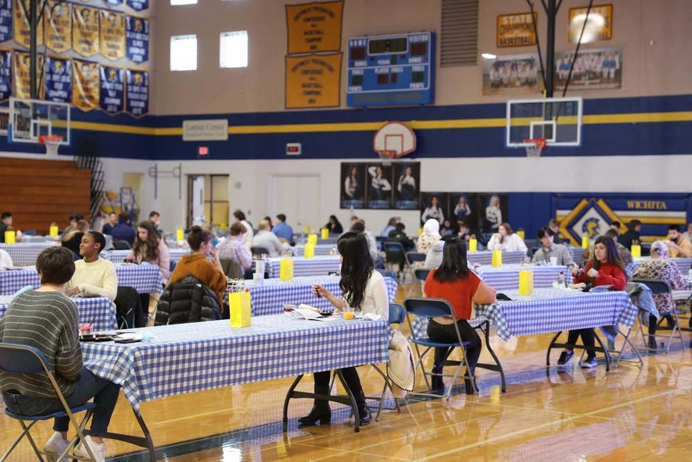 Seniors congregate in the Upper School Gym for a virtual Mentor Day breakfast