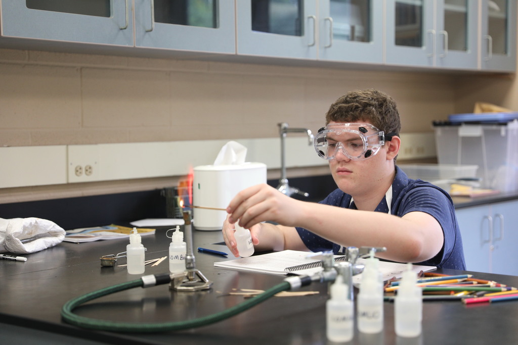 Student works with chemicals and fire